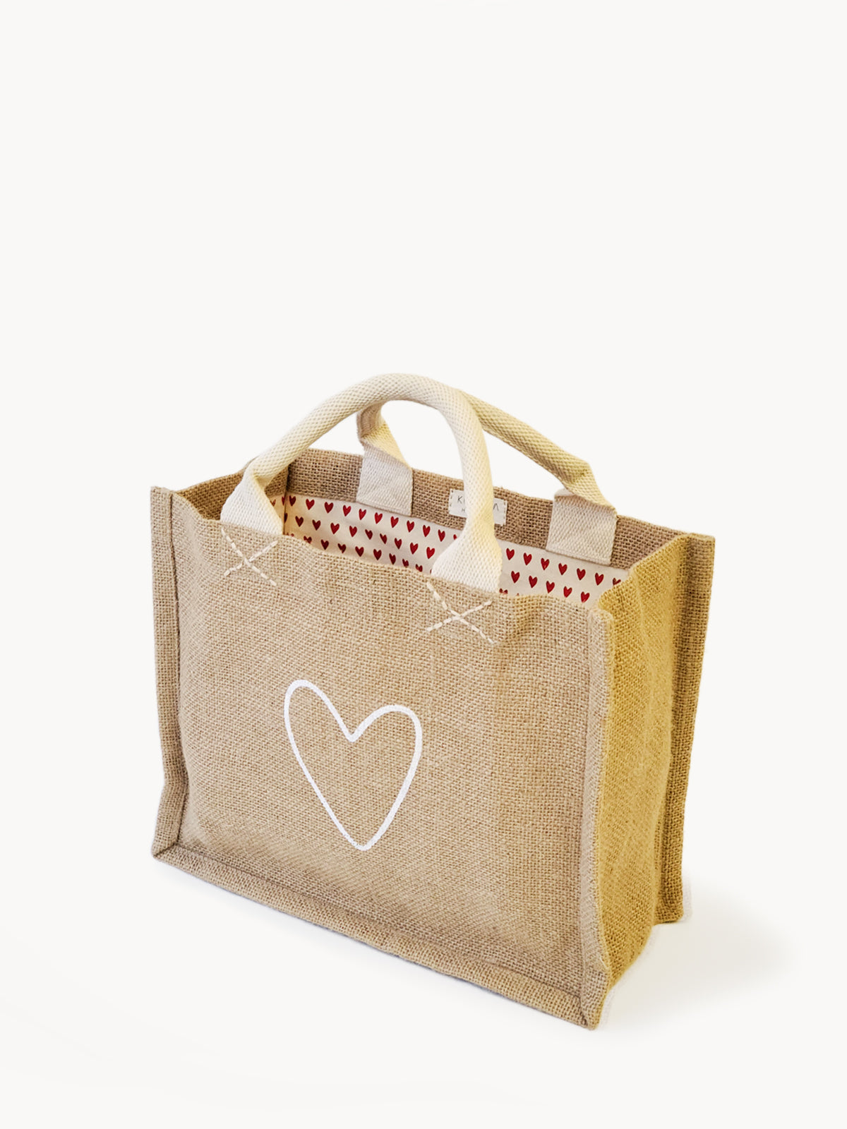 handmade tote bag. market tote. heart print lining. heart print. jute canvas material. 10” tall x 12.5” wide x 6" deep.