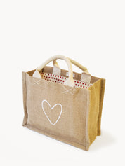 handmade tote bag. market tote. heart print lining. heart print. jute canvas material. 10” tall x 12.5” wide x 6" deep.