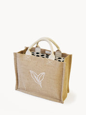 Jute Market Bag. Reusable. Leaf Patter Print. Approximately10” tall x 12.5” wide x 6" deep. Canvas lining with cotton. Colors Natural, White, Green.