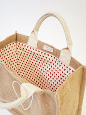 handmade tote bag. market tote. heart print lining. heart print. jute canvas material. 10” tall x 12.5” wide x 6" deep.
