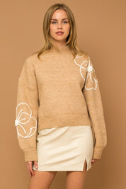 Flower Embroidery Mock Neck Sweater. taupe knit sweater with large white embroidered flowers.