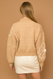 Flower Embroidery Mock Neck Sweater. taupe knit sweater with large white embroidered flowers.