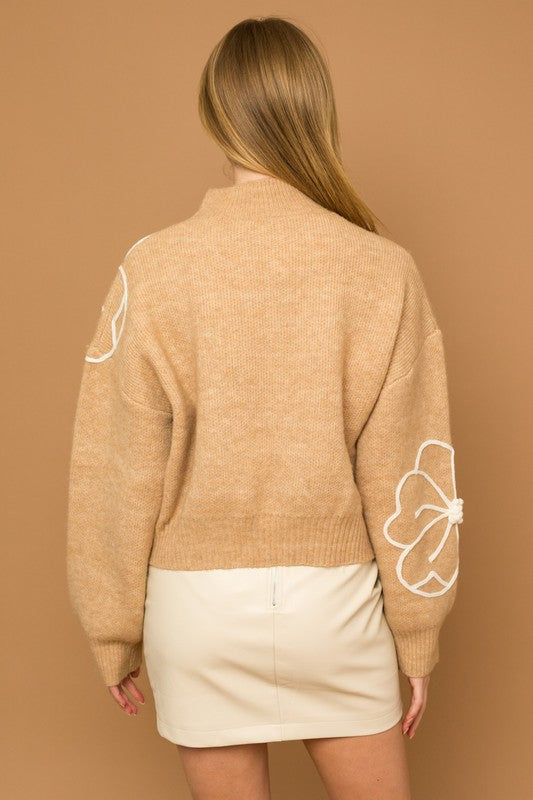 Flower Embroidery Mock Neck Sweater. taupe knit sweater with large white embroidered flowers.