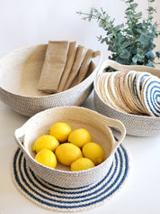 Round shape placemat.  Made with 100% natural Jute. Blue and Natural Colors. 