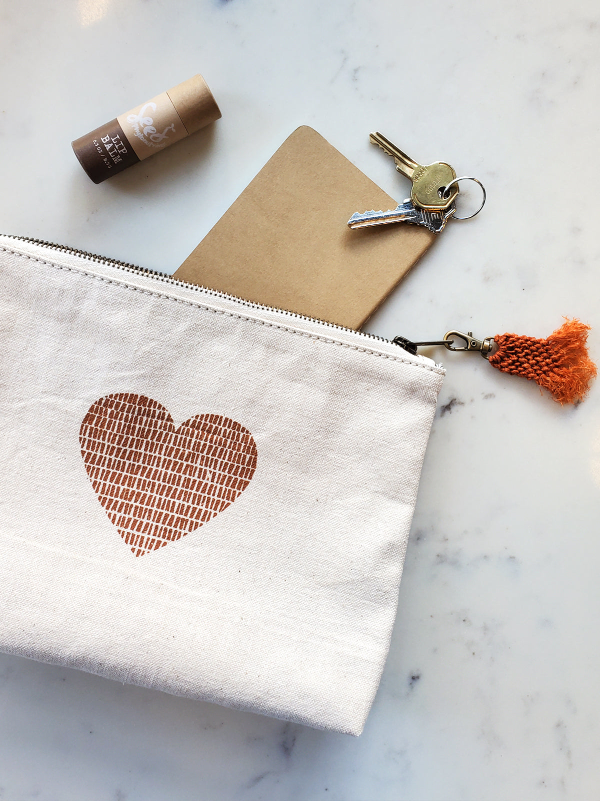 screen-printed pouch. makeup bag. screen printed heart. sustainably handmade by Fair Trade artisans in Bangladesh.