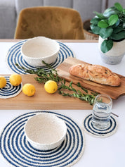 Round shape placemat.  Made with 100% natural Jute. Blue and Natural Colors. 