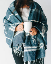 Ethically crafted in Ethiopia. Cotton throw blanket. Measures 38 x 72 inches. navy with natural. 