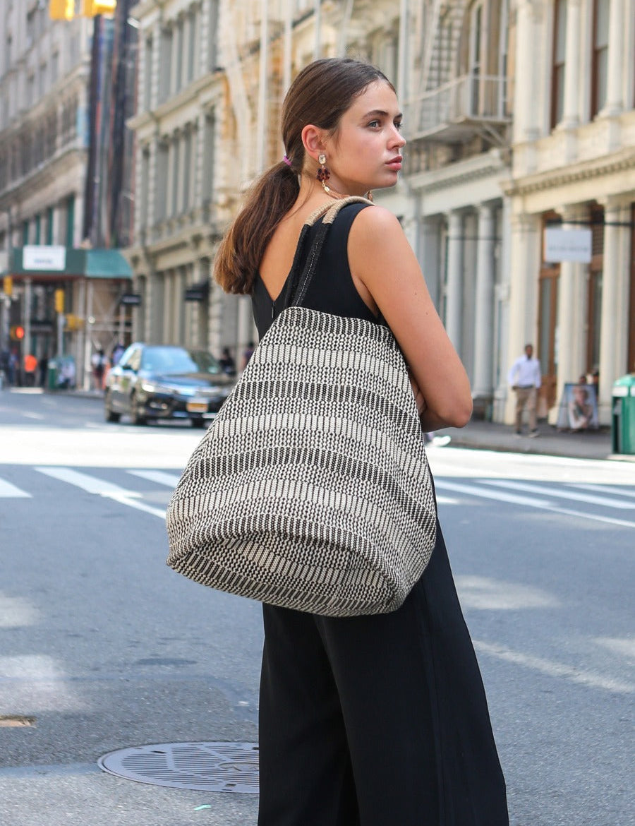 Approximately 15.5”tall x 13.5”round(bottom). Colors Black, Off-White. 100% Handwoven Jute-Cotton Fabric. sustainably handmade reusable market tote.